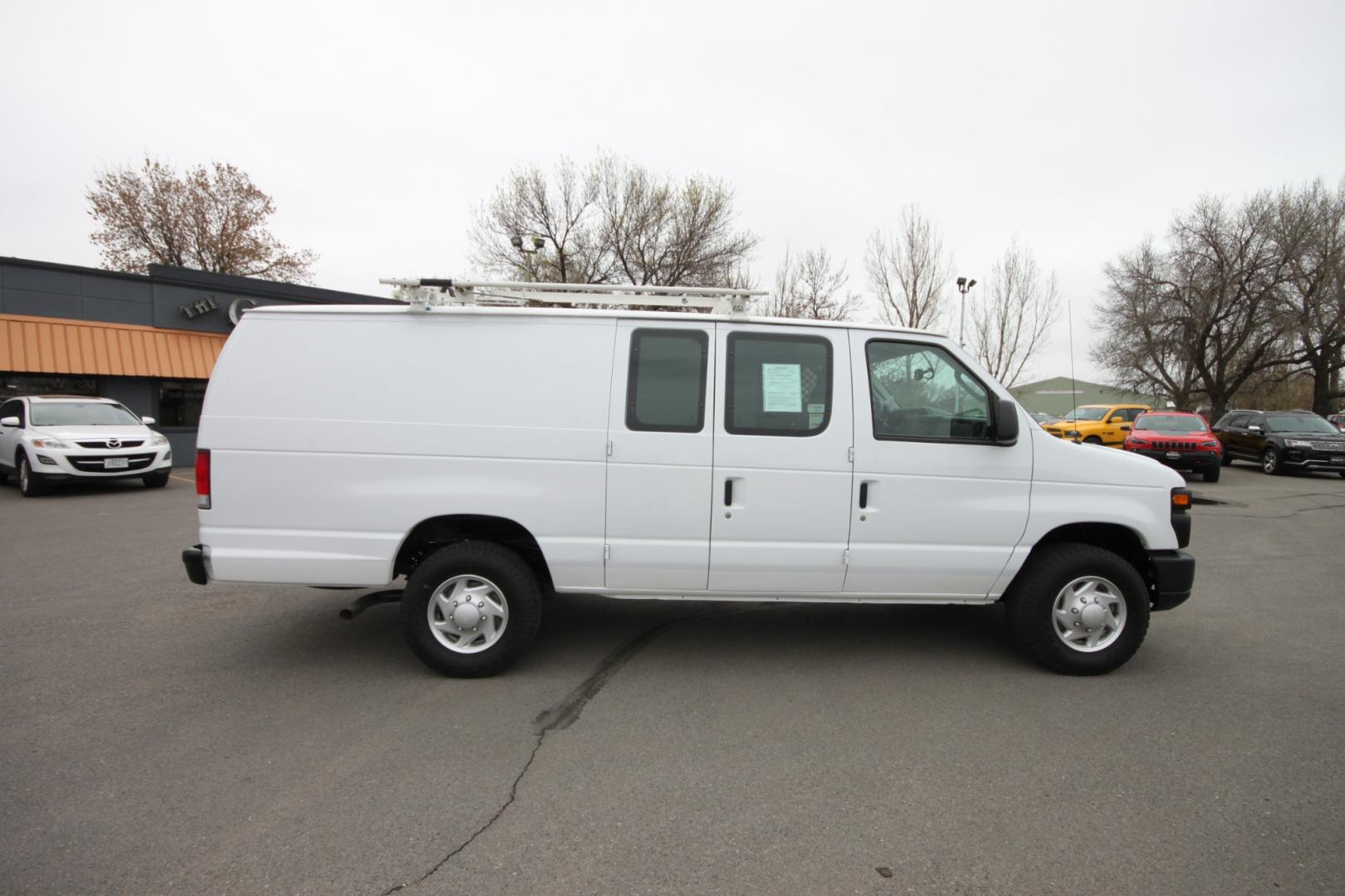 2014 White /Grey Ford E-Series Van (1FTSS3EL3ED) with an 5.4L V8 engine, Automatic transmission, located at 4562 State Avenue, Billings, MT, 59101, (406) 896-9833, 45.769516, -108.526772 - 2014 Ford E-350 Super Duty Extended Cargo Van - One owner - 62,000 miles! 5.4L V8 SOHC 16V FFV Engine - 4 speed automatic transmission - rear wheel drive - 62,752 miles - One owner - Inspected and serviced - Ready to go to work today! Air conditioning - tilt steering wheel - AM/FM audio - powe - Photo#5